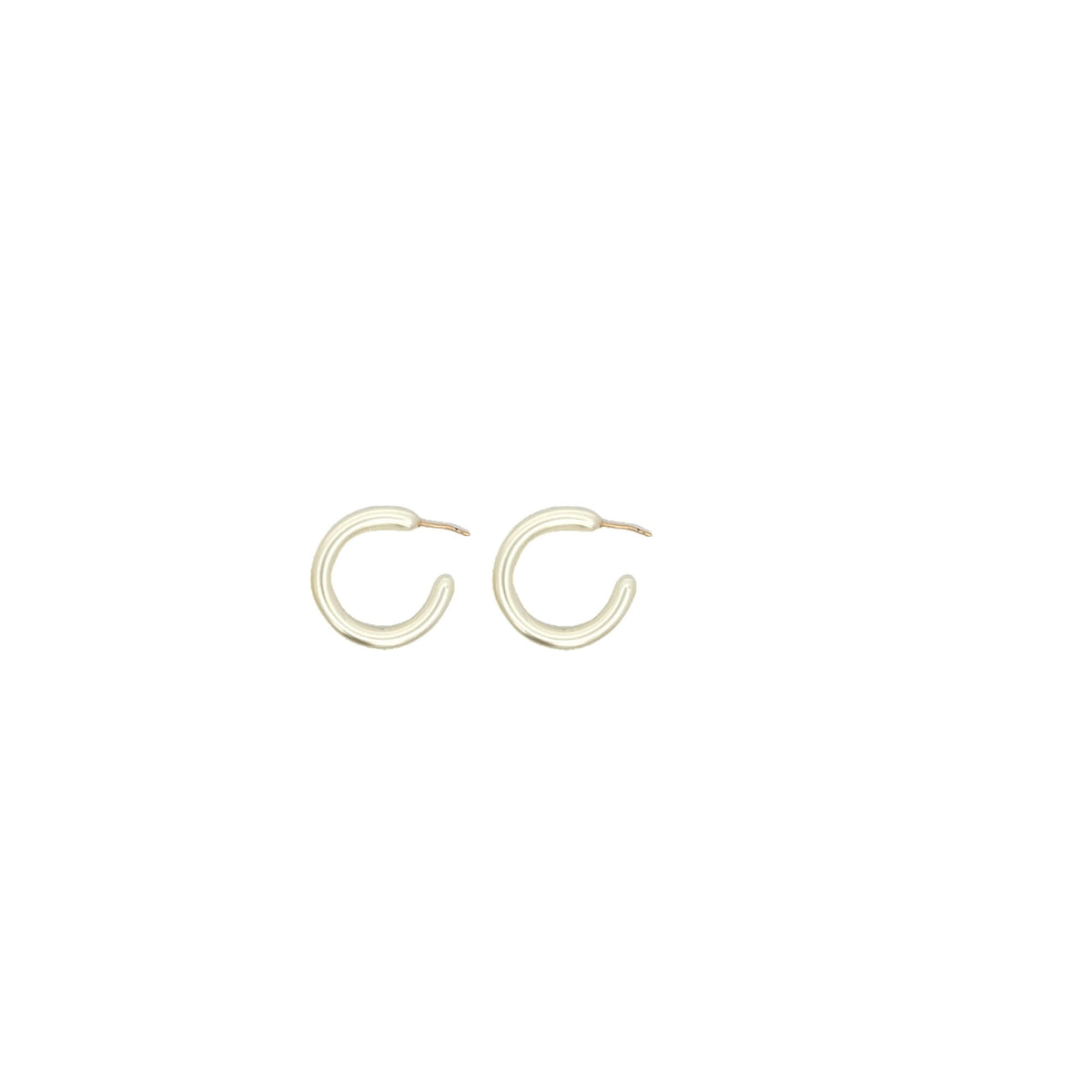 A pair of sleek silver hoop earrings rests against a clean white background.