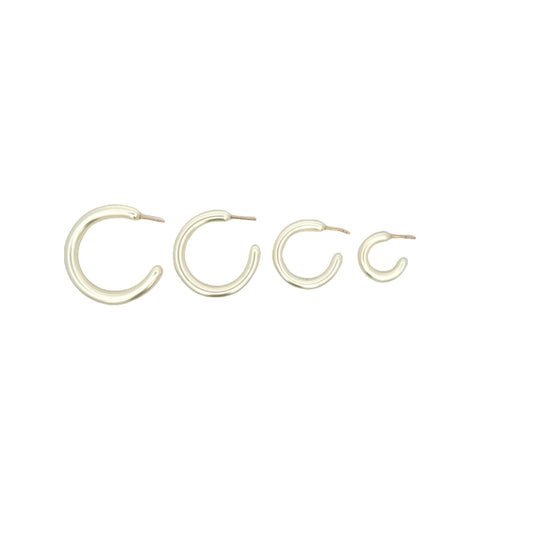 Four gold hoop earrings display in a row, arranged by size from largest to smallest.
