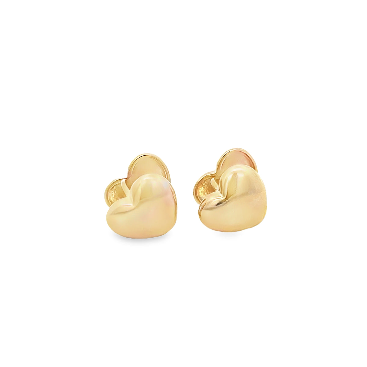 A pair of polished gold heart-shaped stud earrings rests against a clean white background.