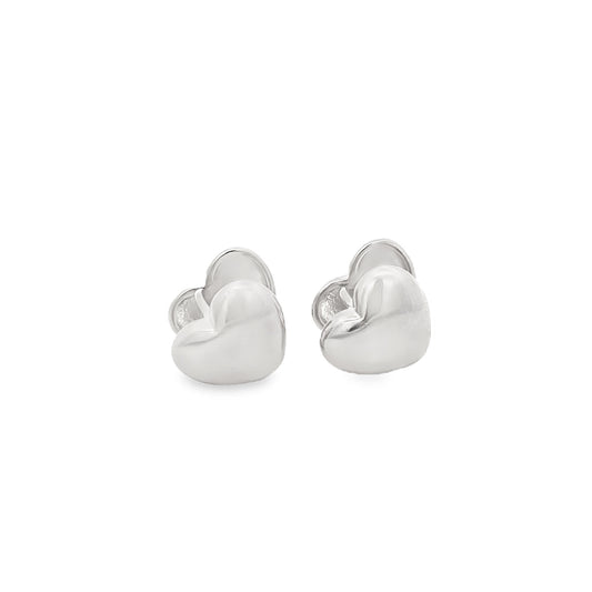 A pair of polished silver heart-shaped stud earrings rests against a clean white background.