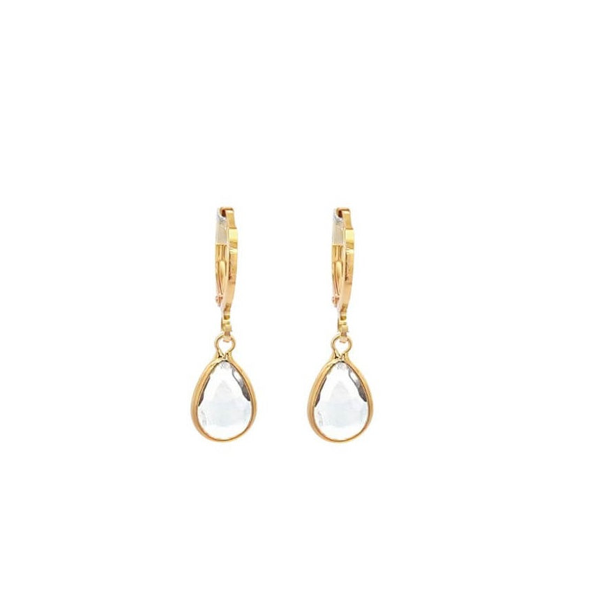 A pair of gold teardrop earrings feature clear crystal stones hanging gracefully from secure clasp hoops against a clean white background.