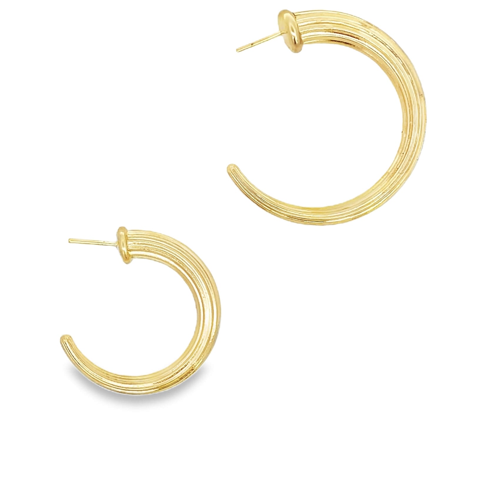 A pair of textured gold hoop earrings displays a polished striped design against a clean white background.