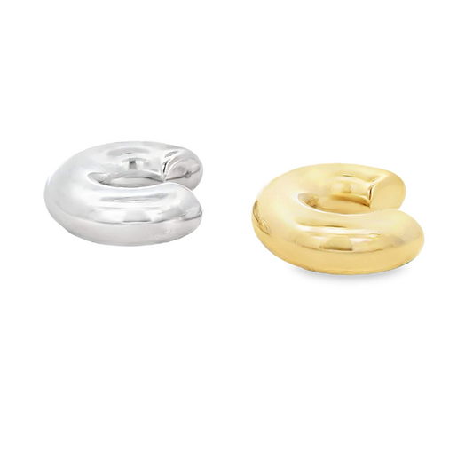 A pair of chunky silver and gold dome ear cuffs rest side by side on a clean white background.