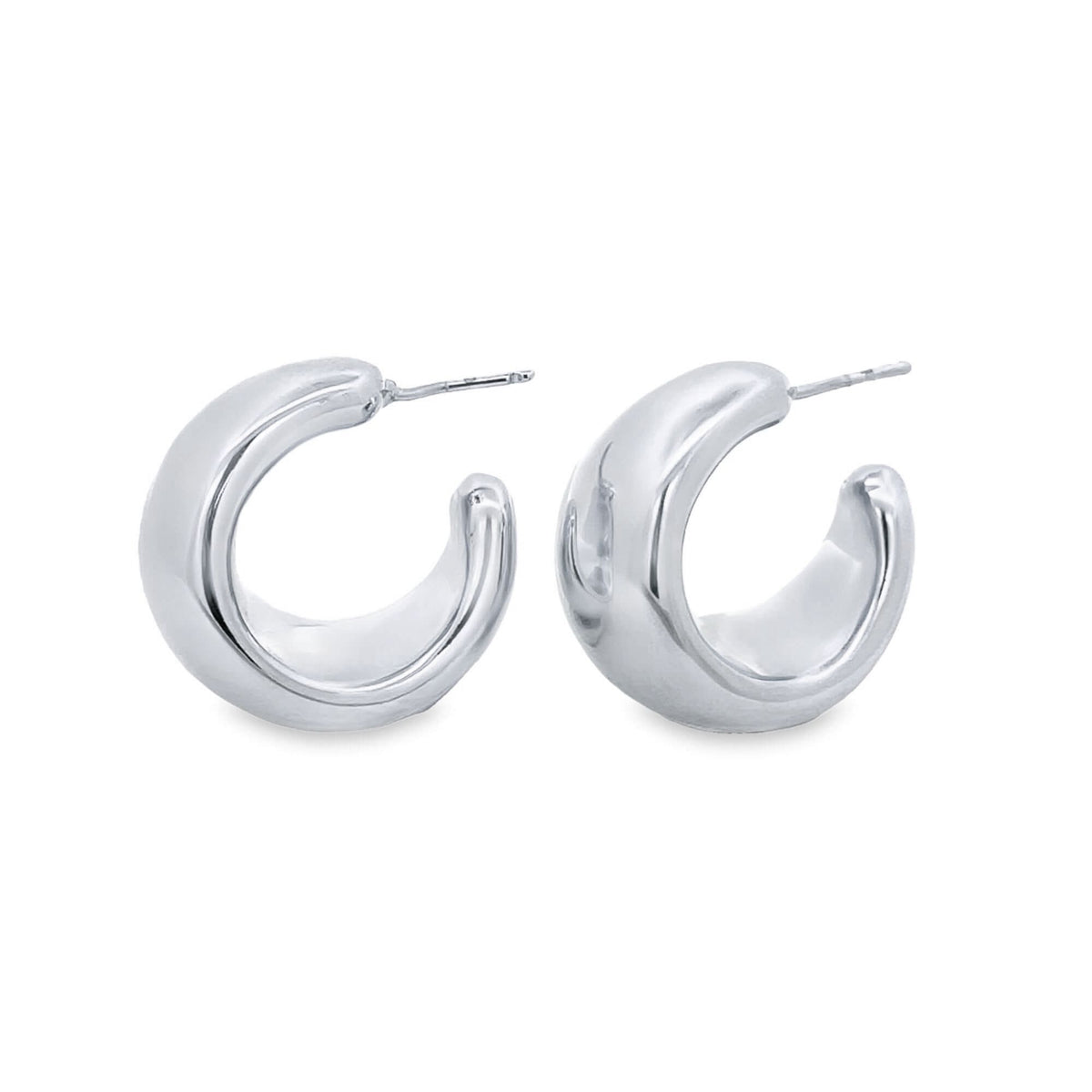 A pair of polished silver chunky hoop earrings rests against a clean white background.