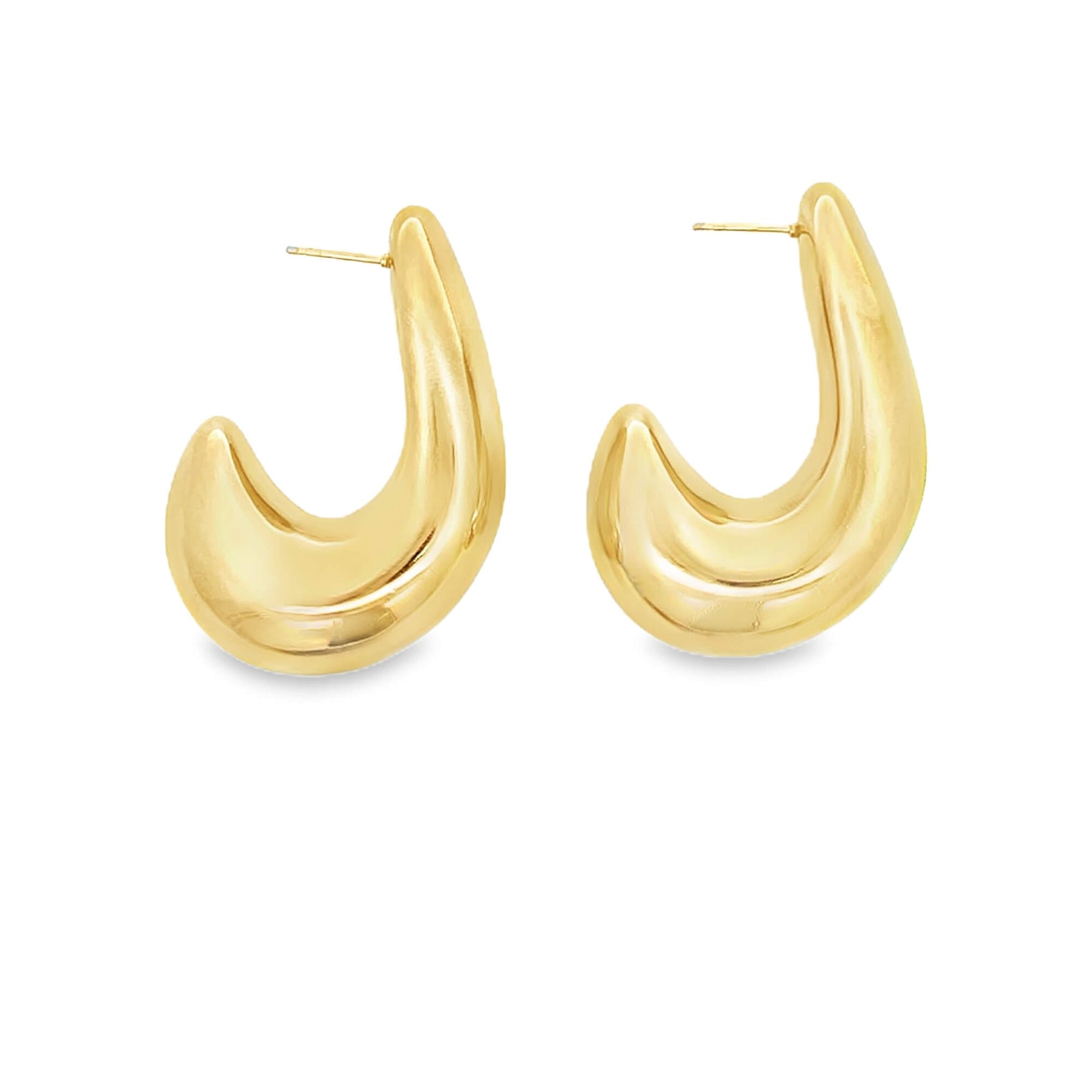 A pair of chunky gold hoop earrings rests against a clean white background, showcasing a smooth, polished finish and an organic, tapered shape.