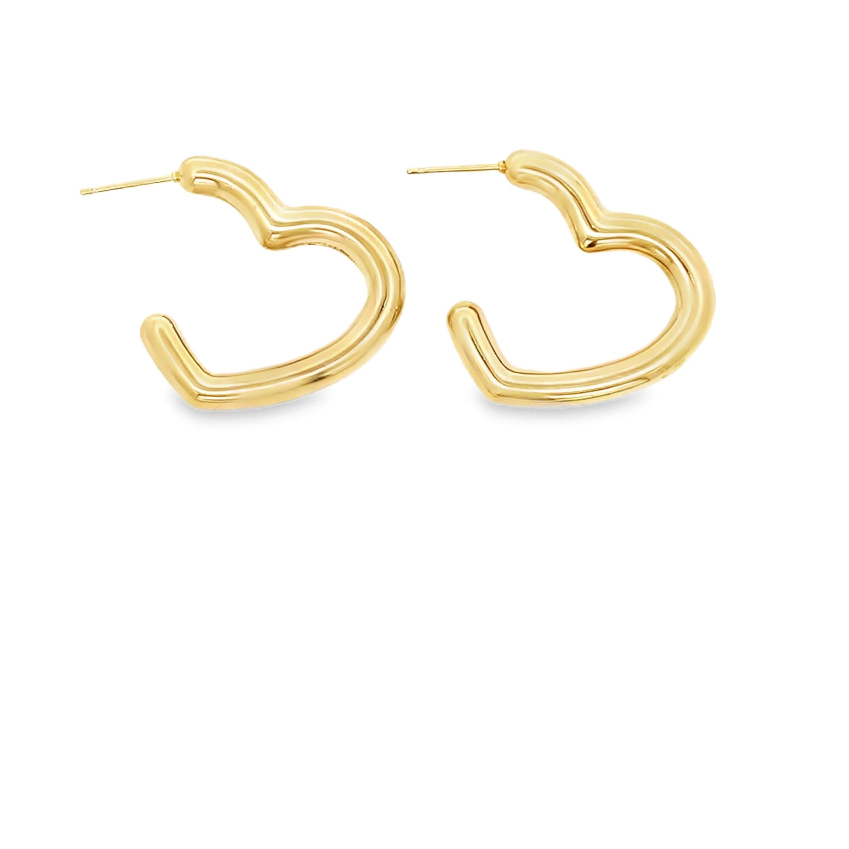 A pair of polished gold heart-shaped hoop earrings rests against a clean white background.