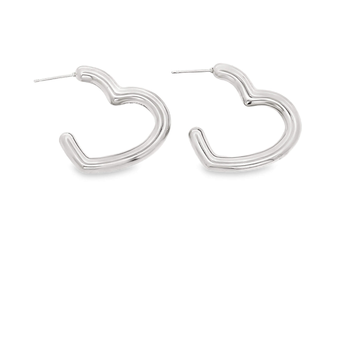 A pair of polished silver heart-shaped hoop earrings rests against a clean white background.