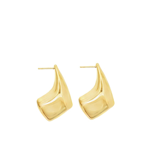 A pair of polished gold geometric hoop earrings rests against a clean white background.