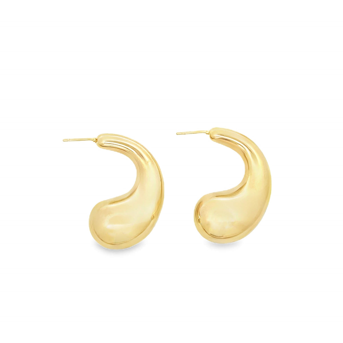 A pair of polished gold teardrop hoop earrings rests against a clean white background.