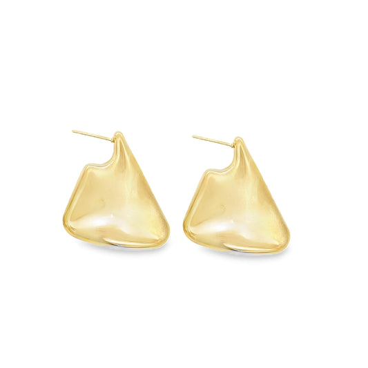 A pair of polished gold abstract geometric stud earrings displays an asymmetrical, flowing design against a clean white background.