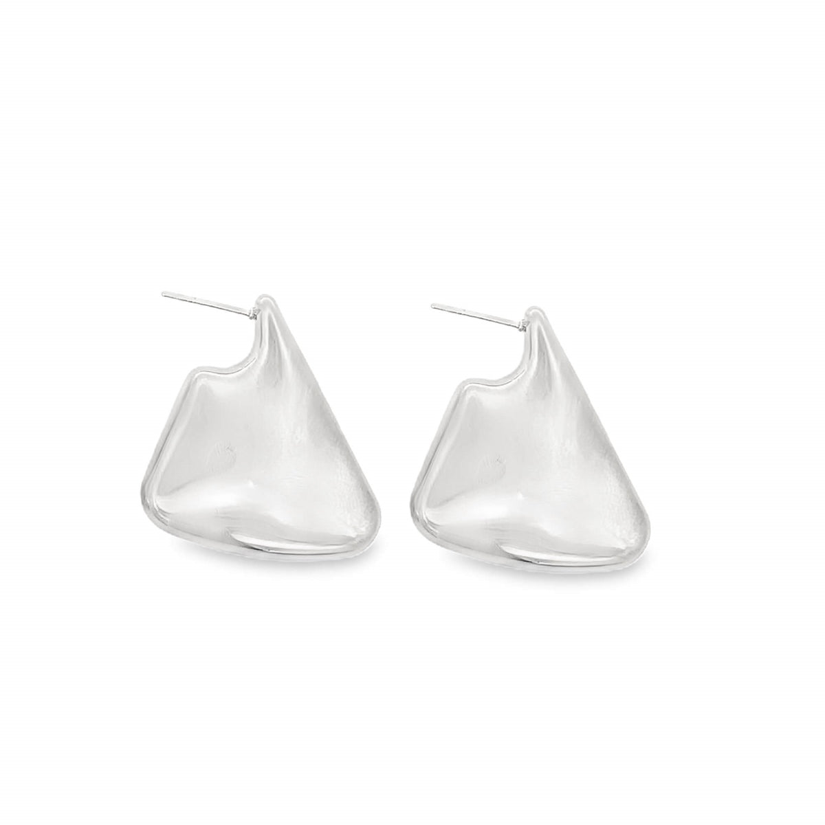 A pair of abstract silver stud earrings with a smooth, melted shape sits against a white background.