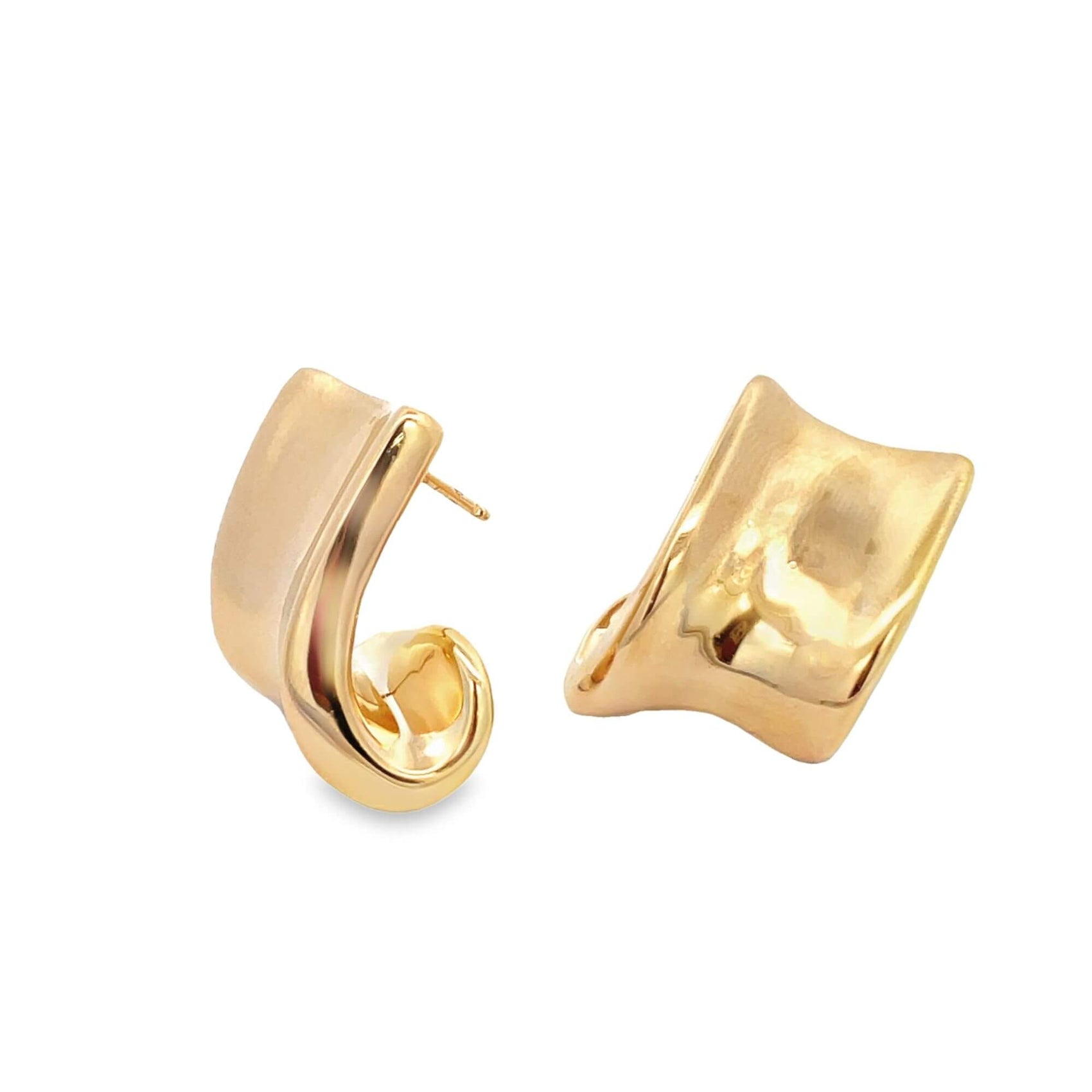 A pair of glossy gold hoop earrings rests against a white background, showcasing a modern, twisted design.