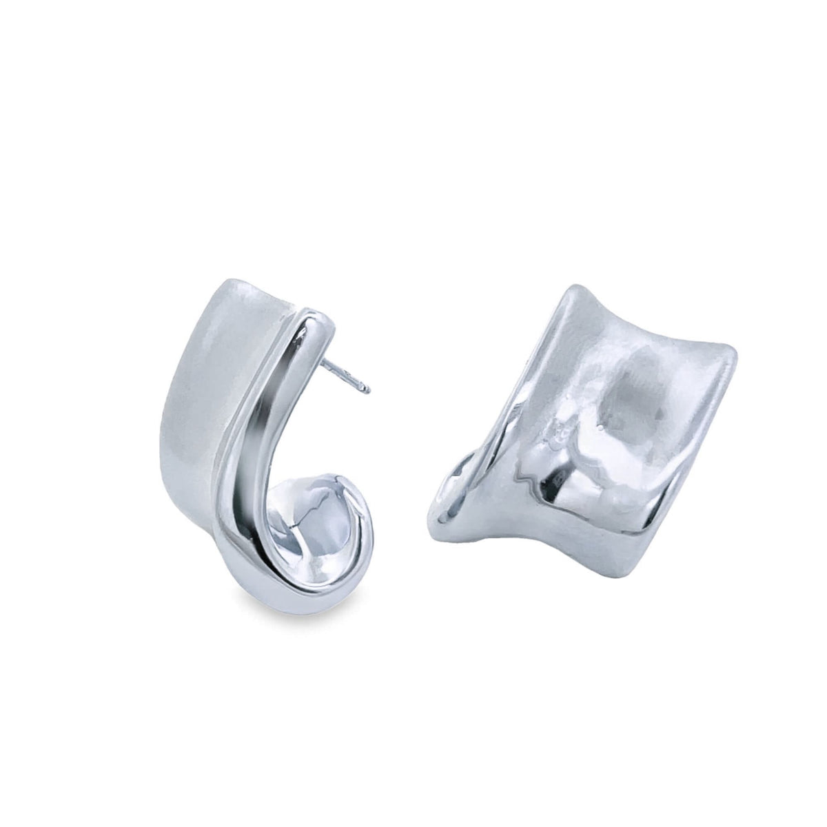 A pair of modern sterling silver hoop earrings with a uniquely curved, chunky design rests against a clean white background.
