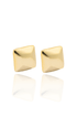A pair of polished gold square stud earrings sits on a reflective white surface.