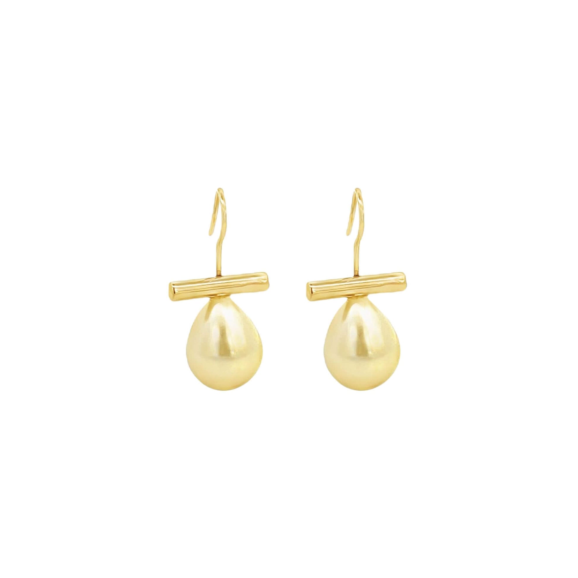 A pair of elegant gold drop earrings featuring teardrop-shaped pearls suspended from a sleek horizontal bar against a plain white background.