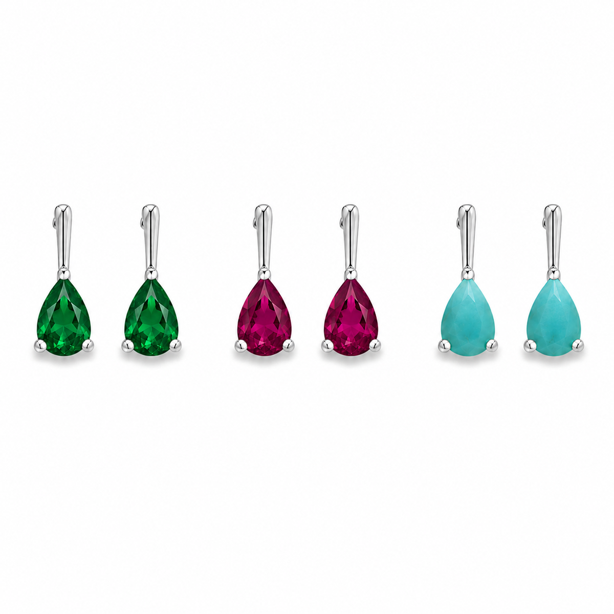 Three pairs of pear-cut gemstone drop earrings in emerald green, ruby red, and turquoise display in a row against a white background.