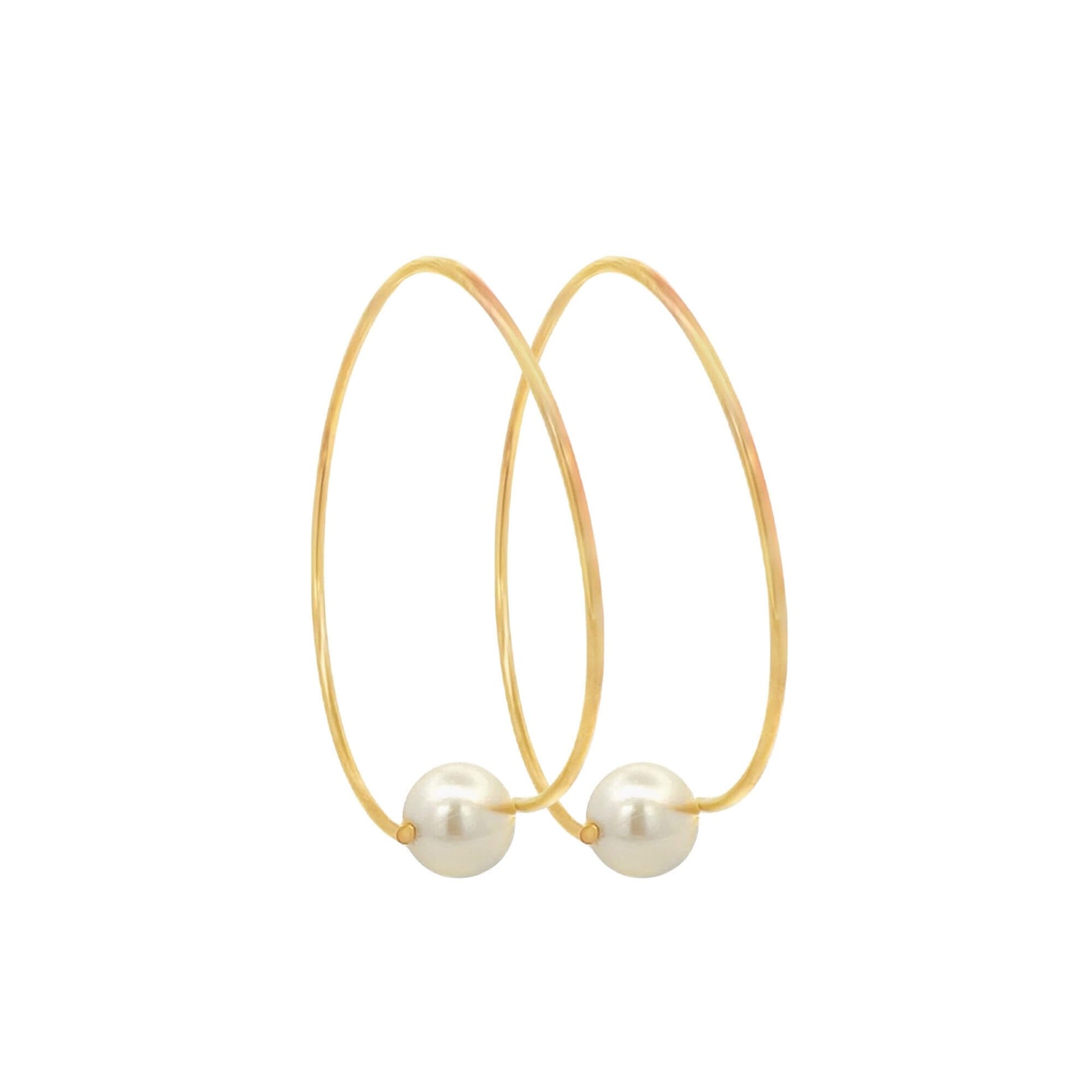 A pair of elegant gold hoop earrings features a single lustrous pearl resting at the bottom of each loop.