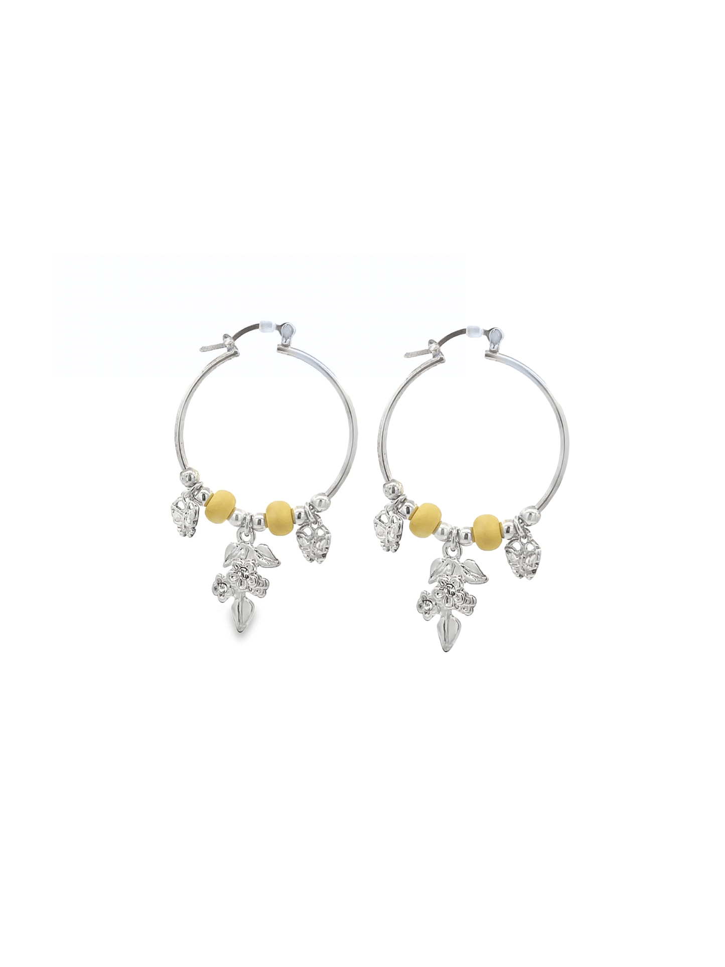 A pair of silver hoop earrings features hanging yellow beads and floral charms.