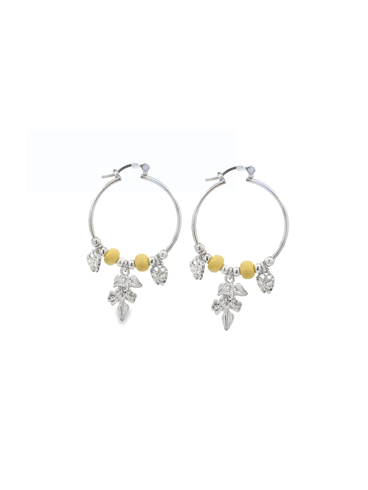 A pair of silver hoop earrings features hanging yellow beads and floral charms.