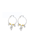 A pair of silver hoop earrings features hanging yellow beads and floral charms.