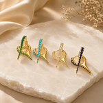 Premium Gold Filled spike huggie earrings featuring brilliant cubic zirconia. Available in Emerald Green, Turquoise, Clear, and Sapphire Blue for a modern everyday look.