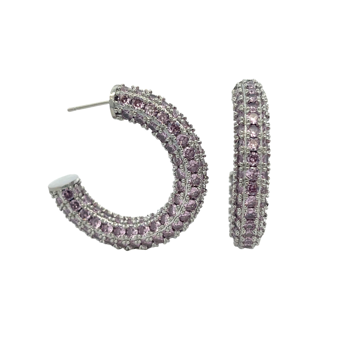 A pair of silver hoop earrings sparkle with encrusted pink cubic zirconia stones against a white background.