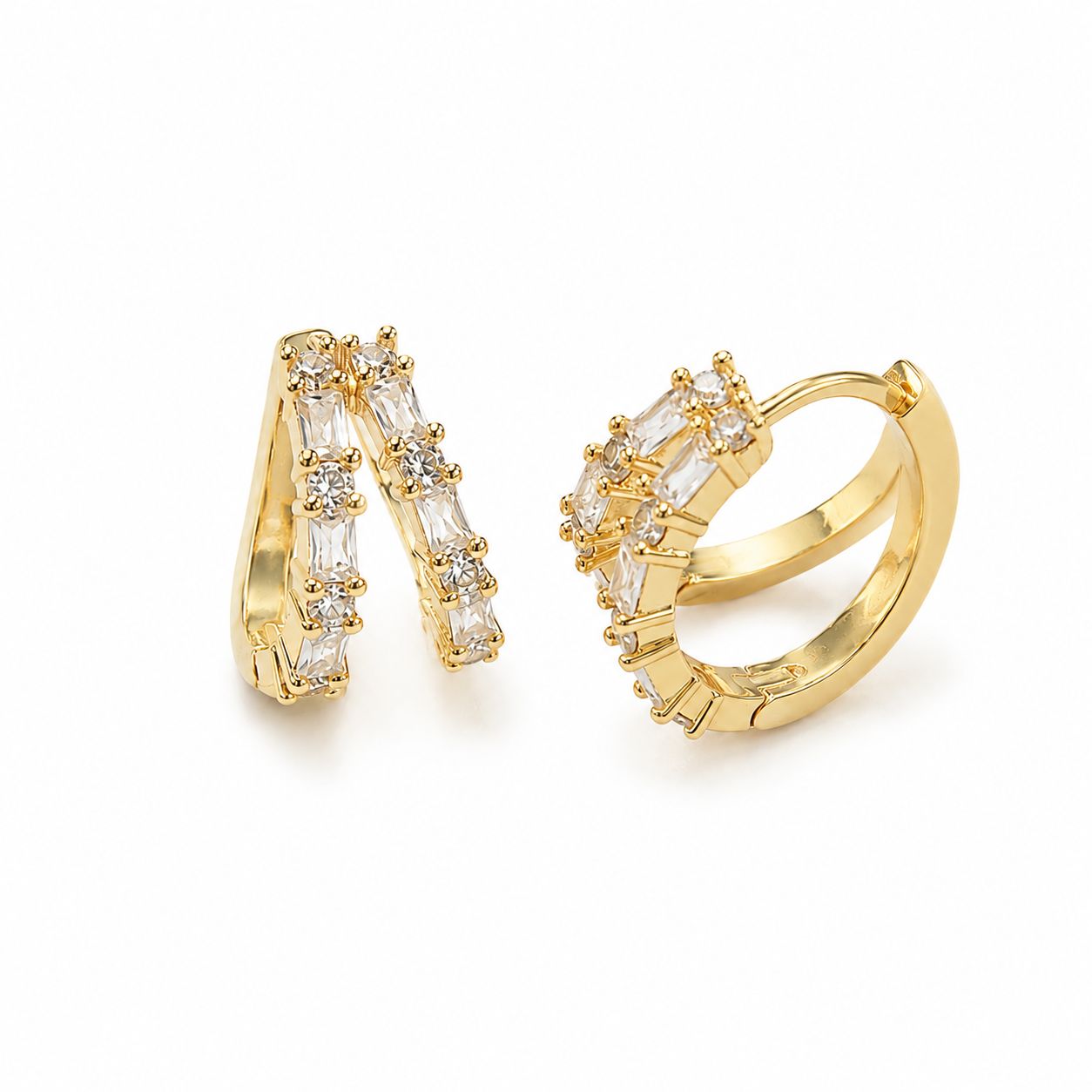 Shop elegant 18K Gold Filled Huggie Hoop Earrings featuring sparkling baguette-cut CZ stones. Lightweight, hypoallergenic, tarnish resistant, and available in multiple colors.