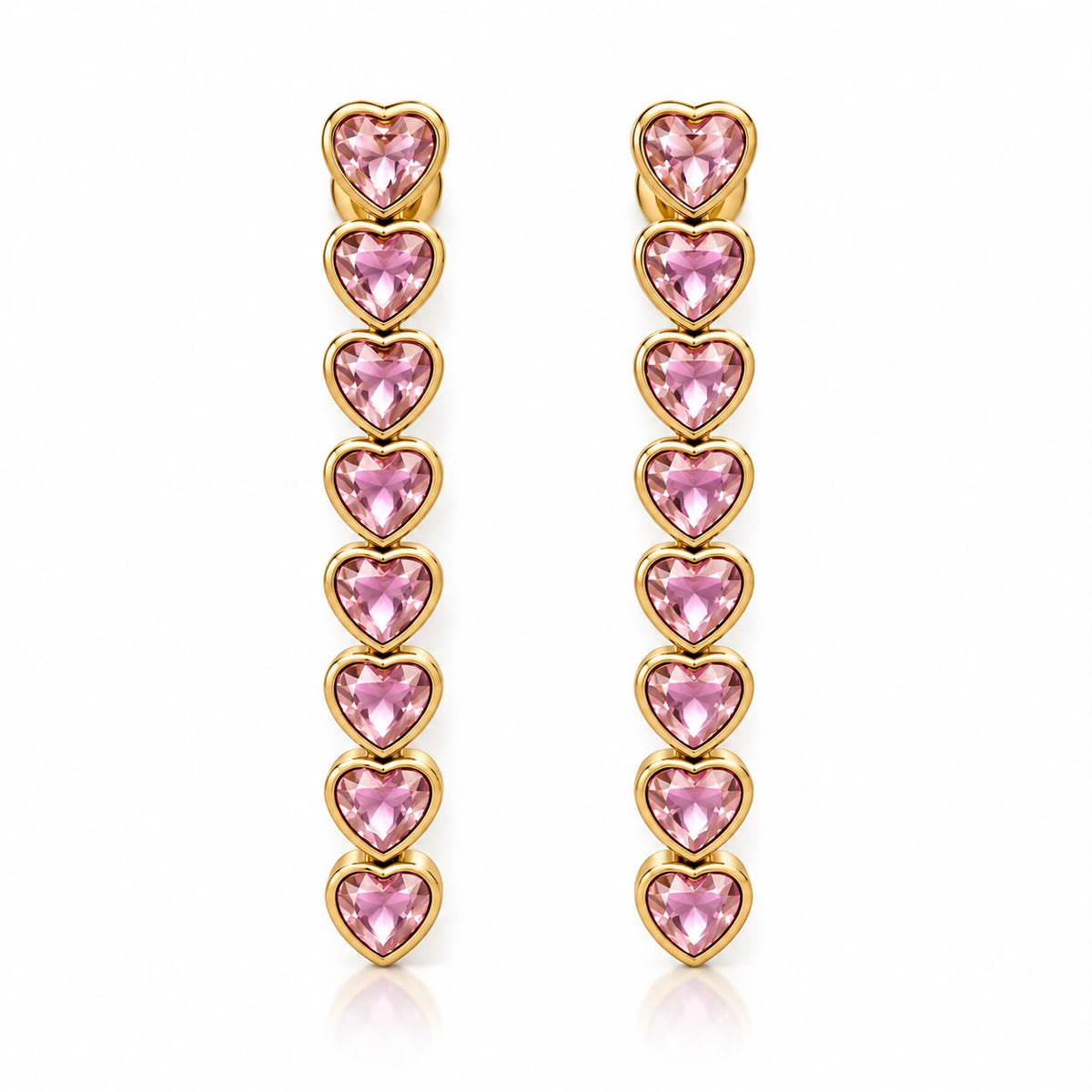 Shop elegant heart-shaped drop earrings featuring linked heart stones and an 18K Gold Filled finish. A sophisticated statement style available in multiple colors.