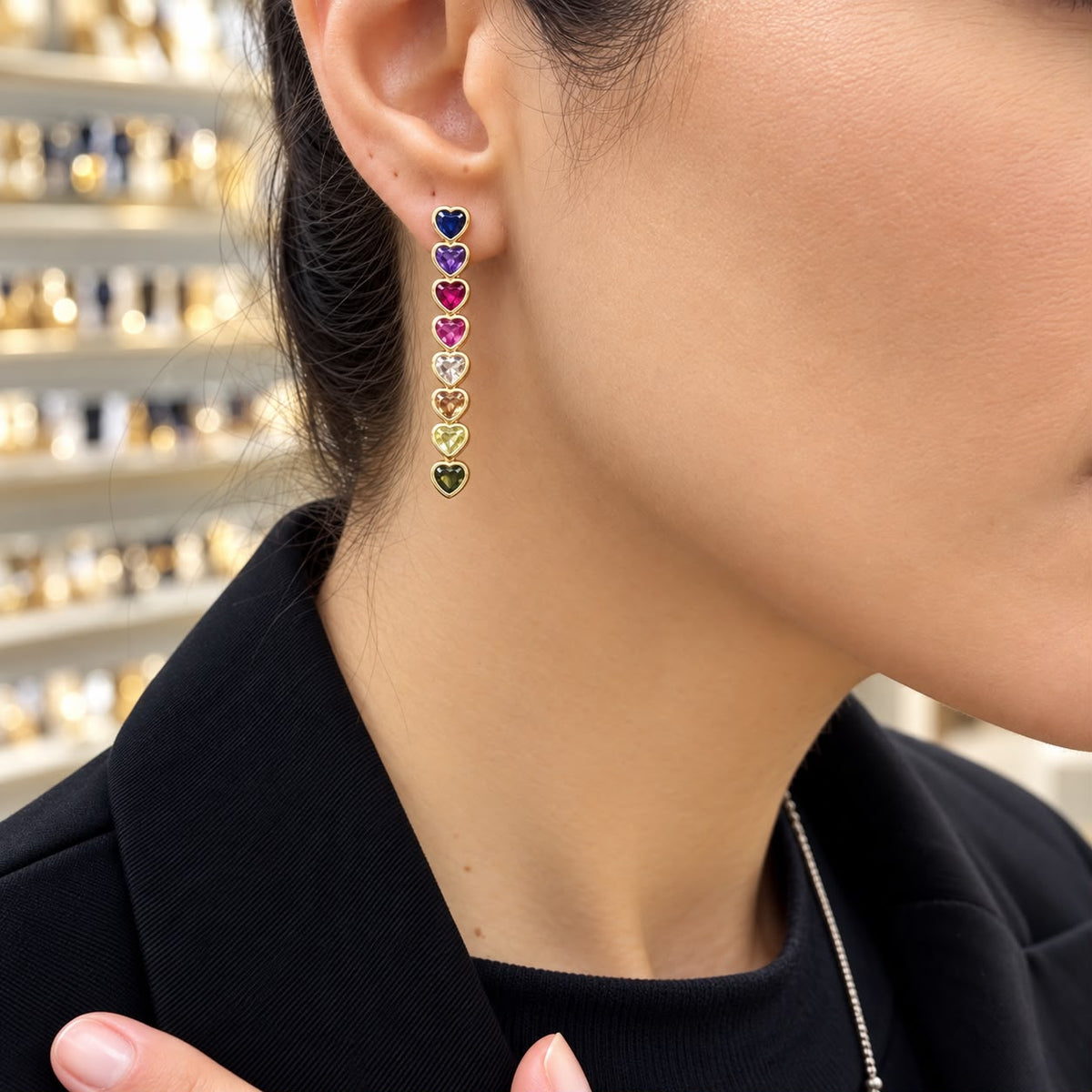 Shop elegant heart-shaped drop earrings featuring linked heart stones and an 18K Gold Filled finish. A sophisticated statement style available in multiple colors.