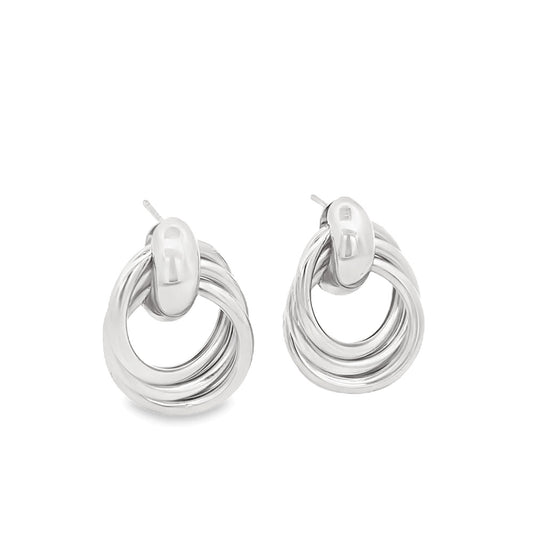 A pair of polished silver multi-hoop earrings featuring interlocking circular bands hangs against a clean white background.