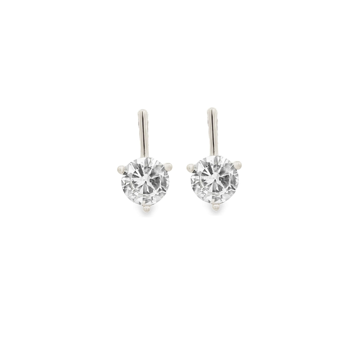 A pair of sparkling solitaire diamond drop earrings glimmers against a clean white background.