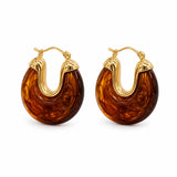Elevate your style with lightweight 18K Gold Filled marbled resin hoop earrings. Glossy statement design available in multiple colors for everyday elegance.