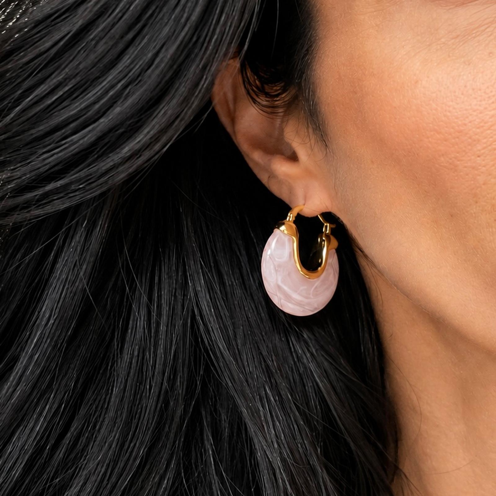 Elevate your style with lightweight 18K Gold Filled marbled resin hoop earrings. Glossy statement design available in multiple colors for everyday elegance.