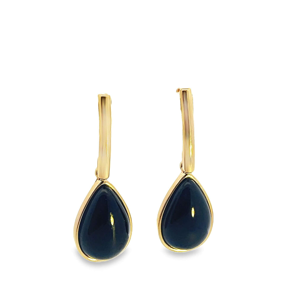 A pair of elegant gold earrings feature teardrop-shaped dark gemstones hanging from slim, polished posts against a clean white background.