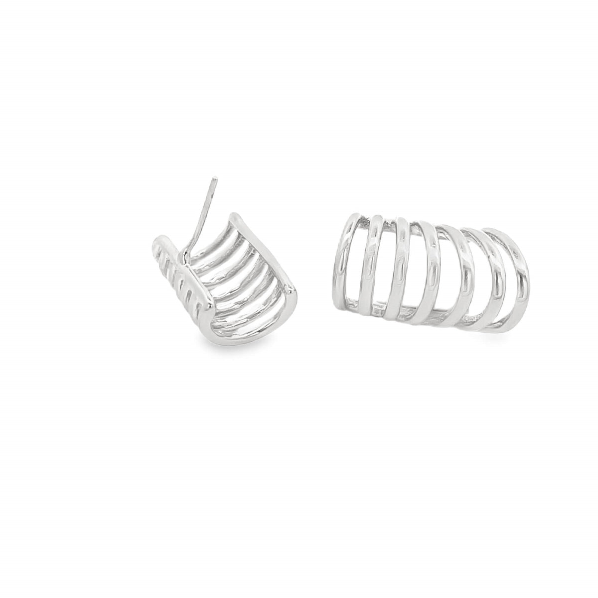 A pair of sterling silver multi-band hoop earrings rests against a white background.