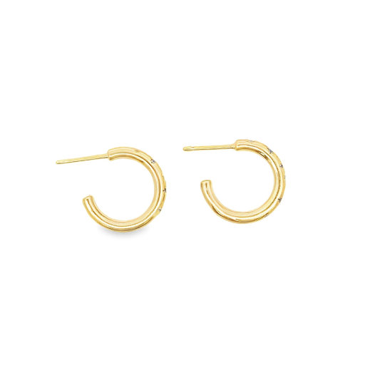 A pair of gold hoop earrings with delicate diamond accents lie flat against a white background.