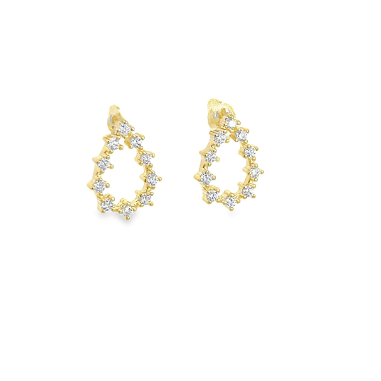 A pair of teardrop-shaped gold earrings sparkling with inlaid diamonds rests against a plain white background.