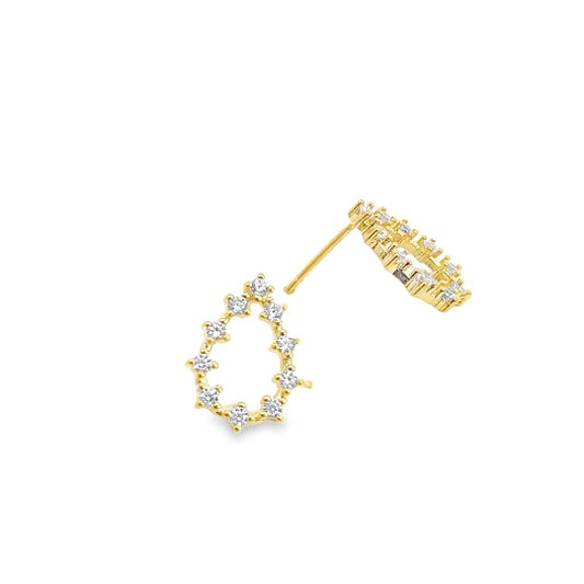 A pair of delicate teardrop-shaped gold stud earrings sparkle with embedded cubic zirconia stones against a clean white background.