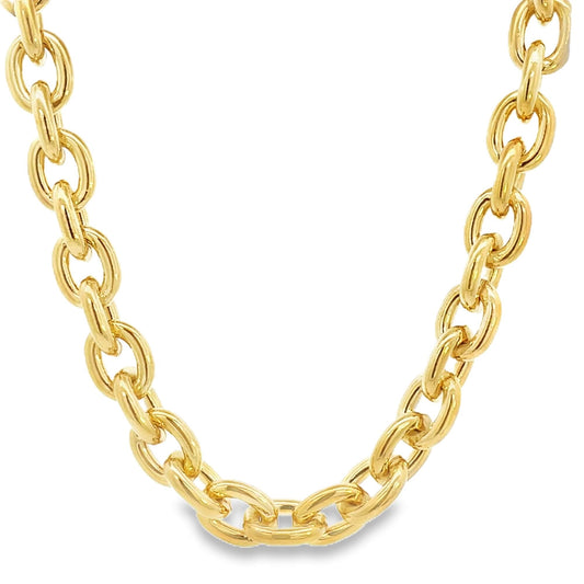 A thick yellow gold link chain necklace curves gracefully against a plain white background.