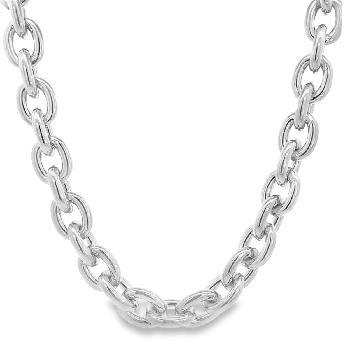 A polished silver link chain necklace curves gracefully against a clean white background.