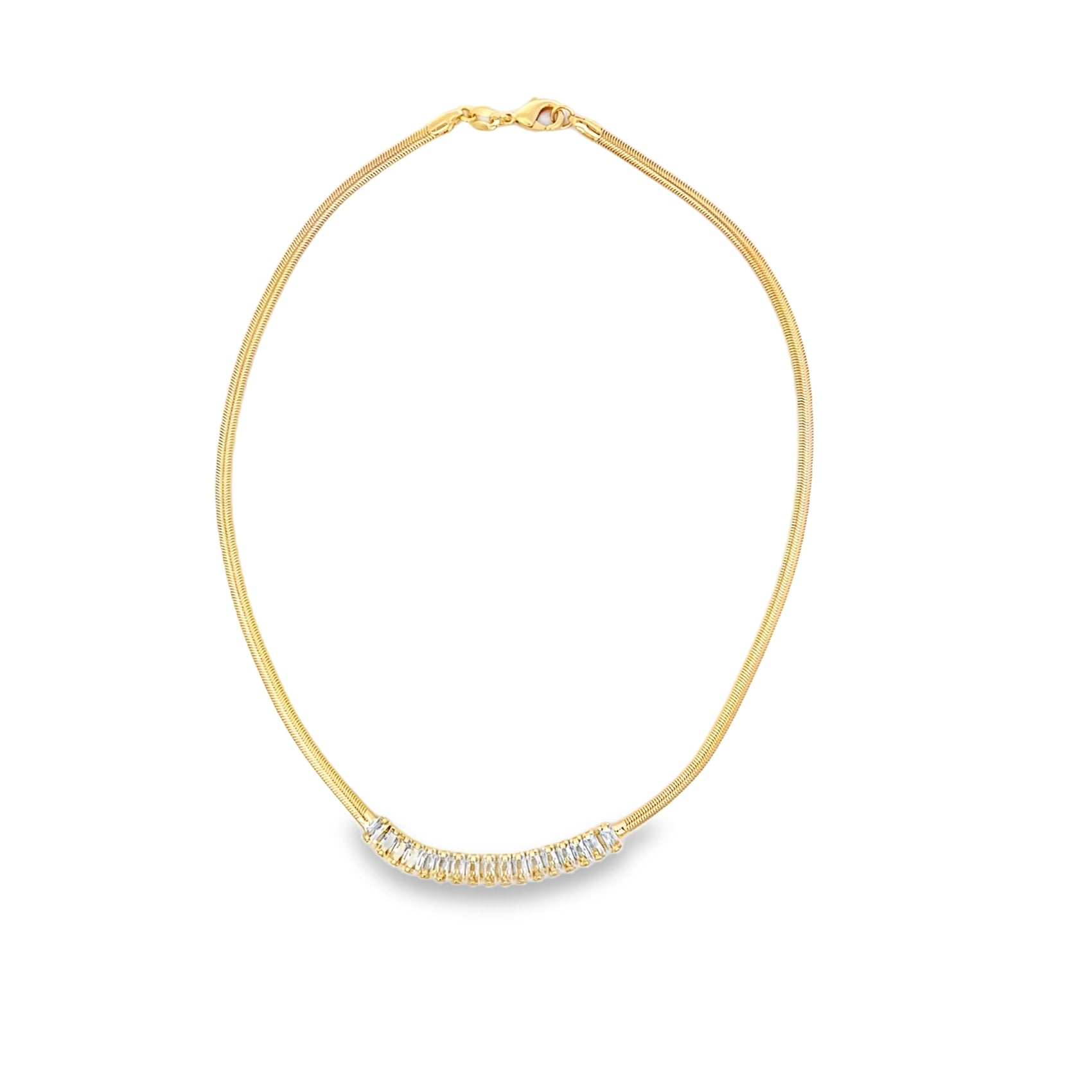 A delicate gold herringbone chain necklace curves gracefully, featuring a shimmering row of baguette-cut diamond gemstones set along the bottom.
