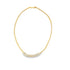 A delicate gold herringbone chain necklace curves gracefully, featuring a shimmering row of baguette-cut diamond gemstones set along the bottom.