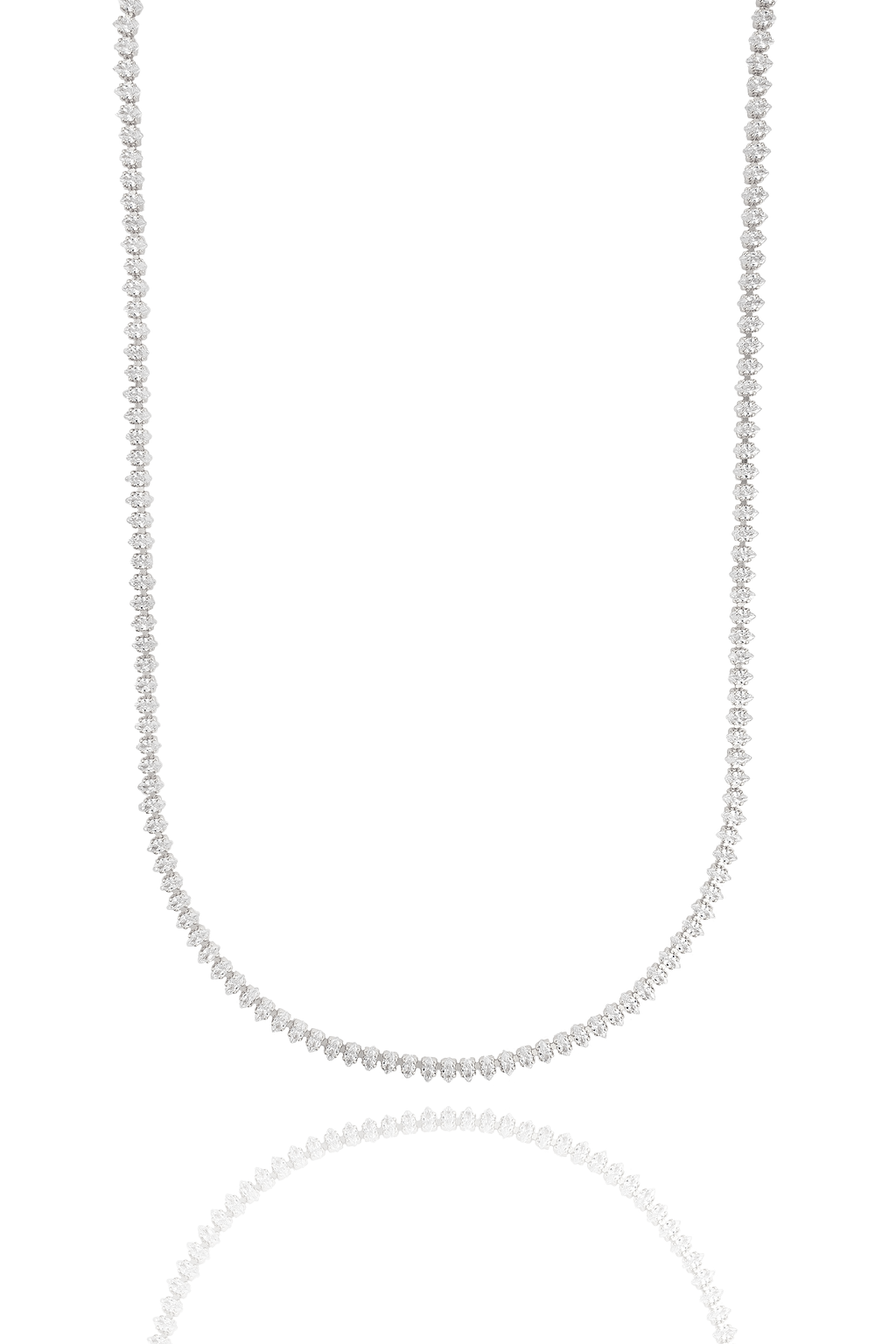 A sparkling diamond tennis necklace drapes gracefully against a clean white background, reflecting softly below.
