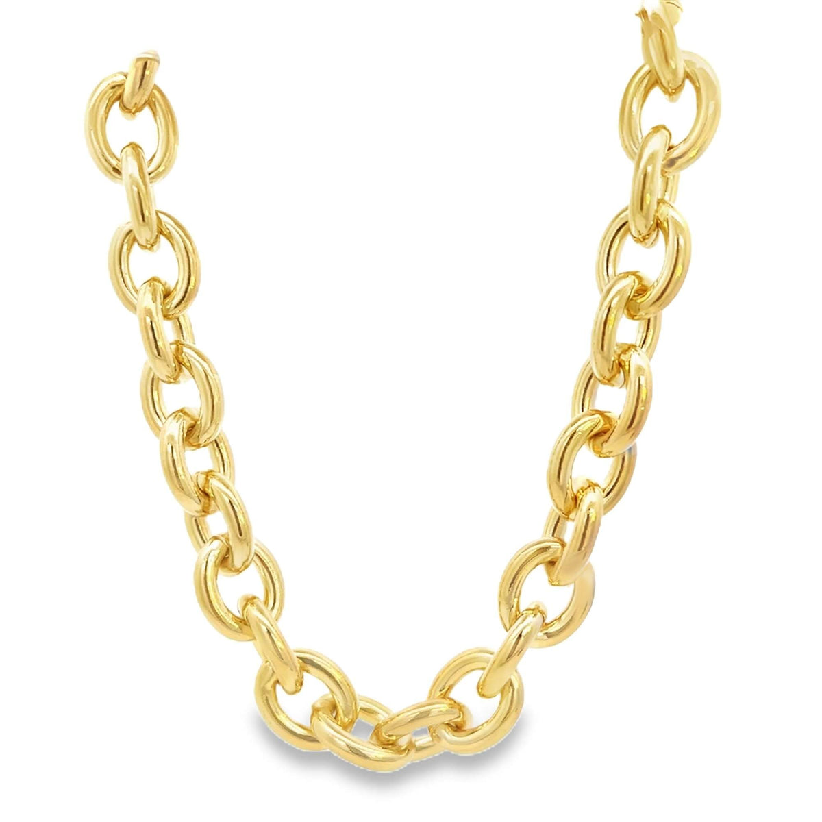 A chunky gold link chain necklace curves gracefully against a plain white background.