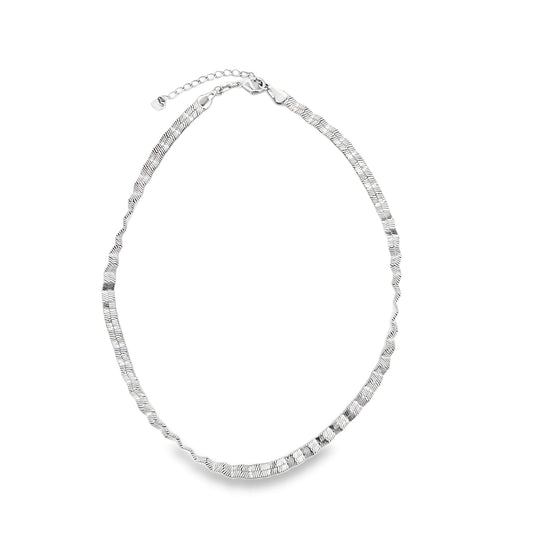 A sleek silver herringbone chain necklace rests on a clean white background.