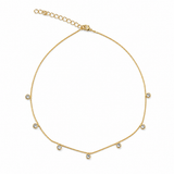 Elegant 14-inch station choker featuring bezel-set Cubic Zirconia stones on a delicate 18K Gold Filled chain. Perfect for layering or everyday wear.