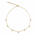 A delicate gold chain necklace sparkles with multiple bezel-set crystal charms arranged symmetrically against a clean white background.