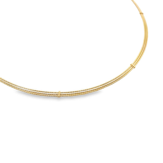 A delicate multi-strand gold choker necklace curves gracefully against a clean white background.