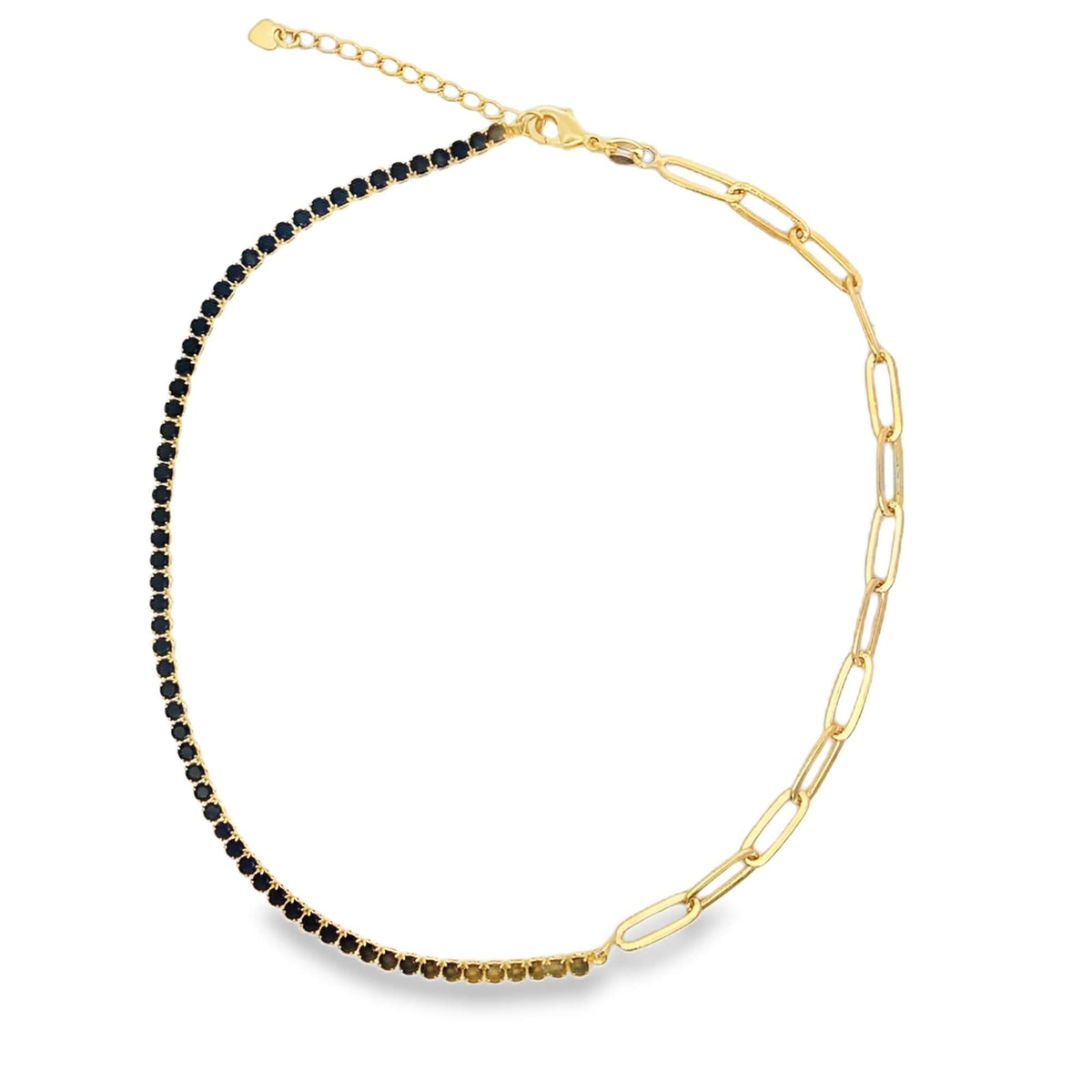 A unique gold chain necklace features a half-and-half design, combining a dark gemstone tennis chain on one side with chunky paperclip links on the other.