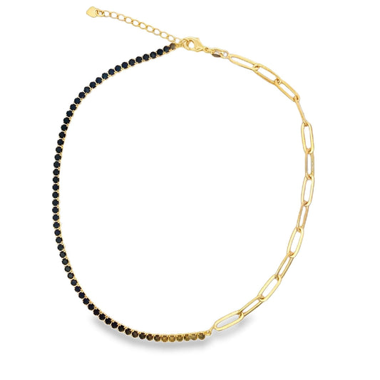 A unique gold chain necklace features a half-and-half design, combining a dark gemstone tennis chain on one side with chunky paperclip links on the other.